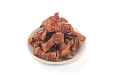 Dried Galangal Root Medicinal Herb Pieces on White Plate Isolated Background for Traditional Medicine and Cooking