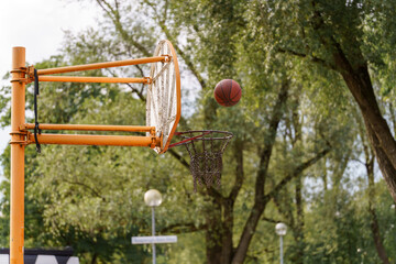 Flying high Over asphalt jungle A ball Finds the net On A summer Afternoon