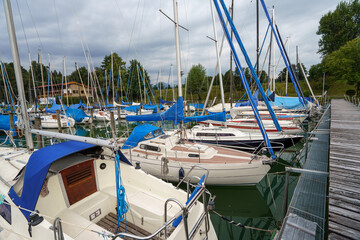 Peaceful morning in Starnberg sees sailboats docked and ready for their next voyage