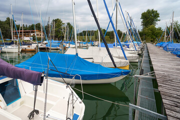 Morning at Starnberger See Marina shows sailboats and reflections in the water