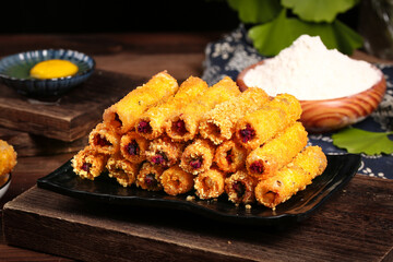 Crispy Golden Fried Spring Rolls with Purple Potato and Traditional Chinese Dipping Sauce