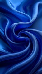 Obraz premium Draped luxurious blue fabric with swirling folds and shadows create a dynamic texture