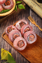 Fresh Guangxi Persimmons with Sugar Coating on Wooden Board