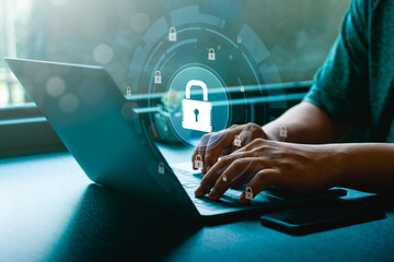 Cybersecurity and data privacy protection concept,  person using laptop, digital padlock on virtual interface representing online security, information encryption, internet data protection technology