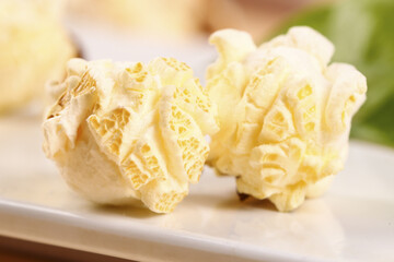 Fresh Popcorn Kernels on White Plate - Delicious Snack