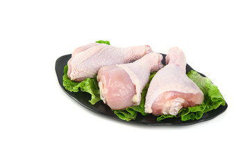 Raw Fresh Chicken Legs and Thighs on Lettuce - Poultry Meat