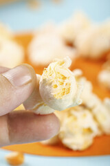 Fresh Popcorn Snack - Close-up Hand Holding Fluffy Kernel