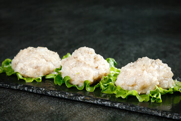 Fresh Handcrafted Shrimp Appetizers with Lettuce on Slate