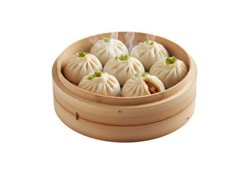 Chinese dumplings, baozi, sitting on a bamboo steamer against a white background.