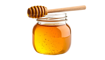 A small glass jar filled with golden honey, a wooden dipper resting on top