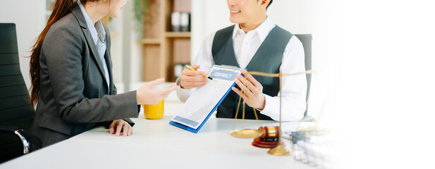 business people and lawyers discussing contract papers sitting at the table. Concepts of law, advice, legal services.