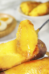 Golden Japanese Kintoki Sweet Potatoes with Honey Glaze in White Dish