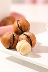 Hazelnuts with Hand Showing Shelled and Peeled Kernels Food Photography