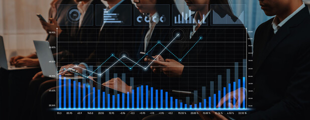 Professionals engaged in analyzing visual data representations during a business conference, highlighting graphs and trends in a corporate environment. Scalp