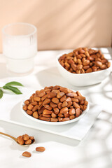 Fresh Pine Nuts in White Bowls on Marble Surface - Healthy Snack Food Photography