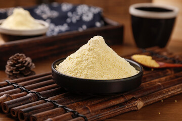 Ground Glutinous Rice Flour in Bowl on Bamboo Mat with Traditional Asian Cooking Ingredients