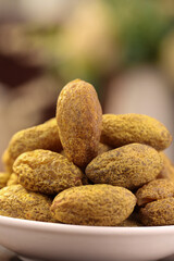 Fresh Raw Almonds in Shell in White Bowl - Healthy Nuts and Dried Fruits for Snacking and Cooking