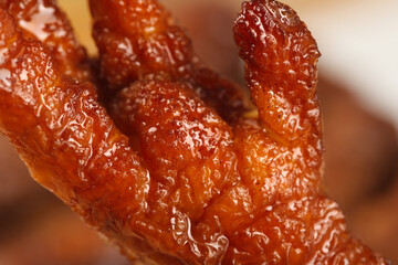 Glazed Marinated Chicken Feet with Soy Sauce - Traditional Asian Cuisine Delicacy Close-up