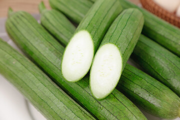 Fresh Long Green Loofahs Sliced Open Showing White Interior - Natural Vegetable and Skincare Product