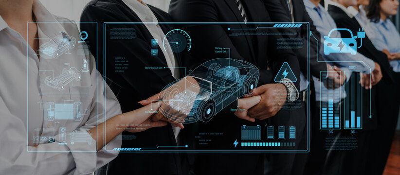 Diverse business professionals in a modern environment collaborate while surrounded by digital interfaces showcasing innovative automotive and electric vehicle concepts. Trope