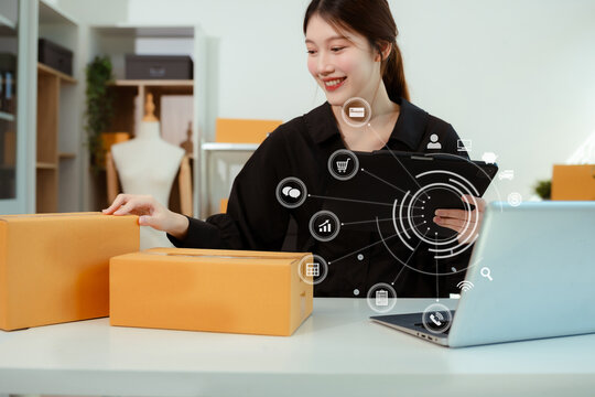 Woman selling products online.entrepreneur or freelance checking orders from customers, woman runs an e-commerce business on websites and social media