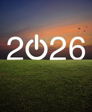 2026 start up business flat icon on green grass field over sunset sky with birds, Happy new year 2026 success concept