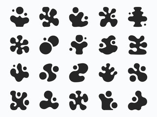 Fototapeta premium Abstract Inkblot Grid of Organic Black Shapes on White Background