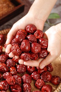 Dried Red Jujubes Hetian Xinjiang Winter Fruit Hands Holding Traditional Chinese Healthy Snack Food