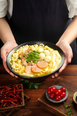 Fresh homemade ramen noodle soup with beef and eggs served in traditional bowl