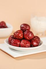Red Dried Dates from Xinjiang Hetian China on White Plate Traditional Healthy Food Ingredient