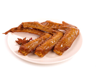 Spicy Glazed Duck Wings with Star Anise - Traditional Asian Marinated Poultry Dish on White Plate