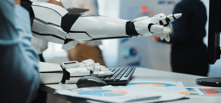 A robotic arm extends towards a digital display, highlighting cutting-edge technology in a modern office. This image captures the essence of innovation and automation.Noogenesis