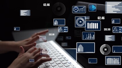 A close-up view of hands typing on a laptop, surrounded by various digital graphs and data visualizations in a dark atmosphere, representing modern business analysis. Xenic