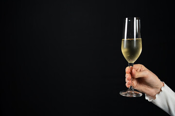 Hand holding flute glass