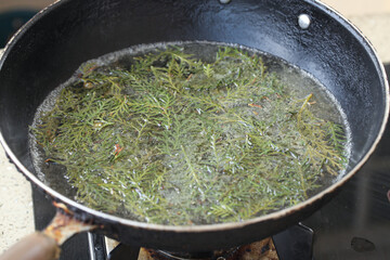 Fresh Green Leaves Boiling in Water - Traditional Vegetable Cooking Method