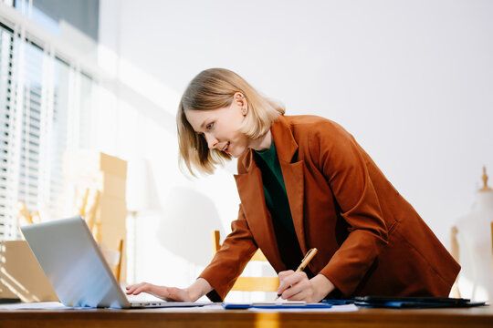 Designer selecting color palette while working on a creative branding project in a modern bright workspace. - Powered by Adobe