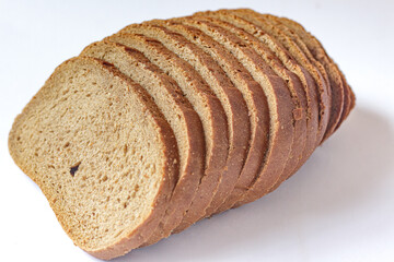 Top View of a Sliced Loaf of Whole Grain/Rye Bread on a White Background.