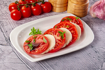 Italian caprese salad with mozzarella, tomato and basil