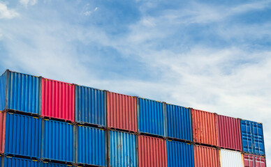 Fototapeta premium Cargo ship container goods export import international transport on blue sky background, warehouse industry business logistics transportation harbor port industrial shipping terminal cargo ship.