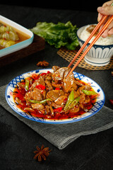 Traditional Chinese Braised Pork with Peppers and Chopsticks
