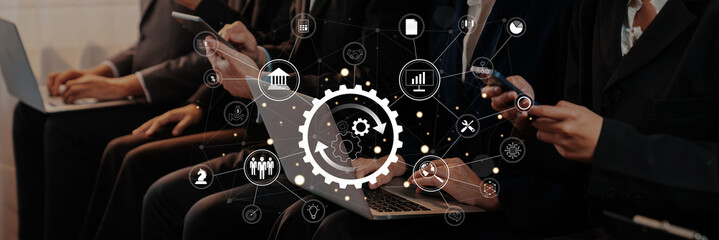 A diverse group of professionals interact with laptops and smartphones, surrounded by digital icons, symbolizing innovation and effective communication in modern business environments. Trope