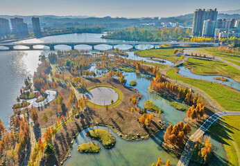 Fototapeta premium Urban Wetland and City Harmony in Autumn - Aerial Photography