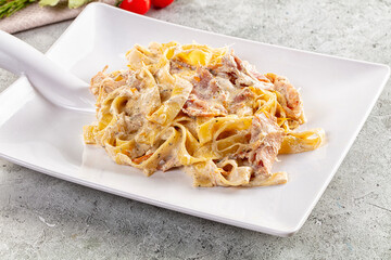 Italian pasta fettuccine with prosciutto