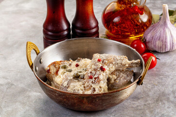 Roasted rabbit legs in cream sauce