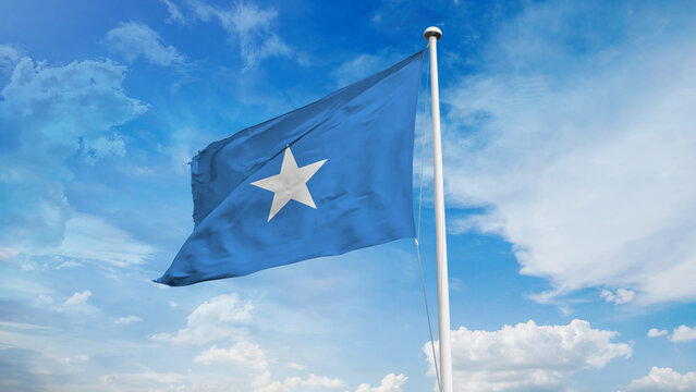 Realistic close-up of the Somalia flag waving on a tall flagpole under a bright sky with soft scattered clouds, showing smooth wind motion, vivid blue colors, and a clear atmosphere of national pride.