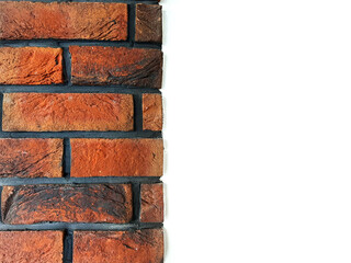 Naklejka premium Red brick wall on the left side with blank white copy space for text or design on the right