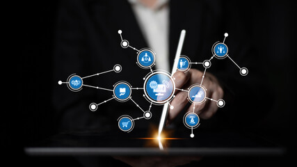 Professional businessman interacts with a digital tablet showcasing a modern interface, demonstrating technology and data analytics in a business setting. Tessel