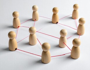 Wooden Peg People Connected by Red String Representing Networking
