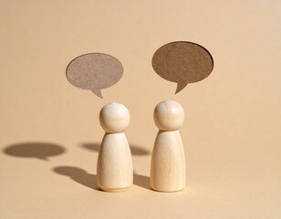 Two Wooden Peg Dolls with Cardboard Speech Bubbles