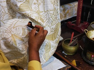  Woman making batik